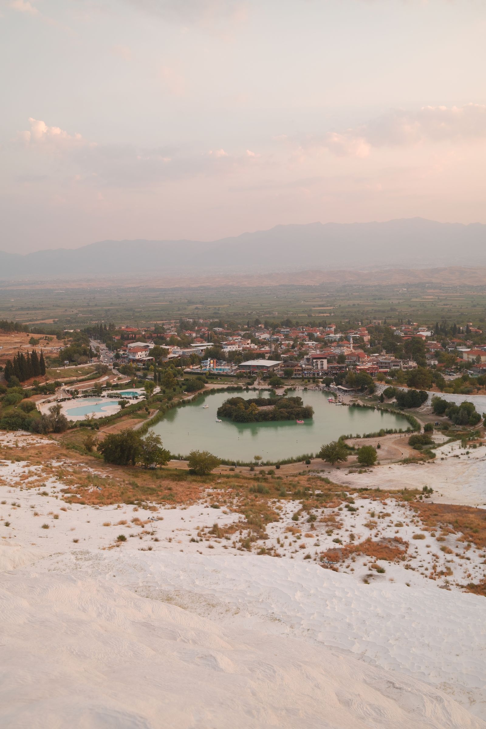 Pamukkale terraces and town from the air at sunset