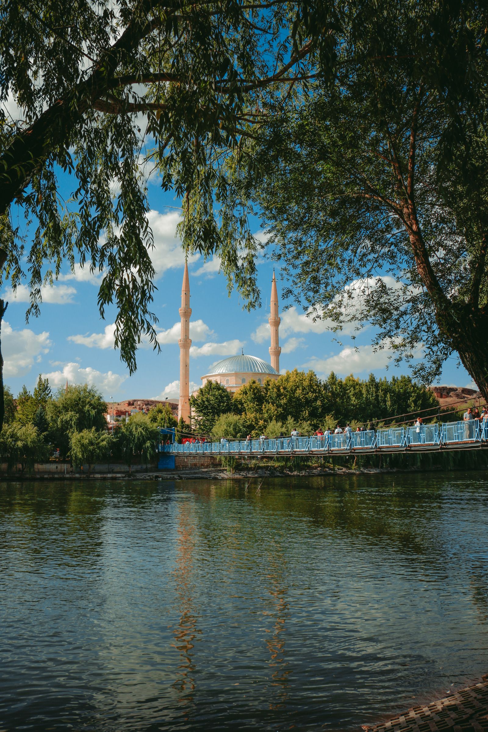 Footbridge over the Kizilirmak river at Avanos with the mosque behind